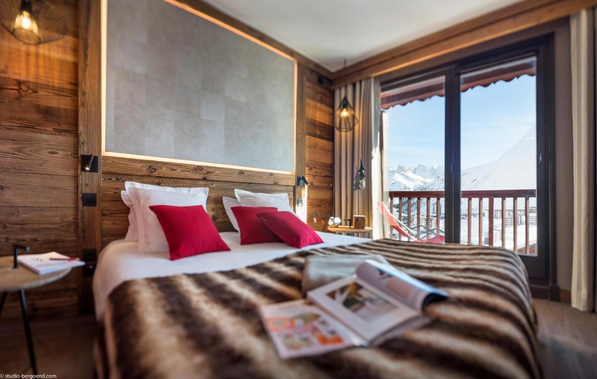 Un ou plusieurs lits dans un hébergement de l'établissement Hôtel Village Montana by Les Etincelles