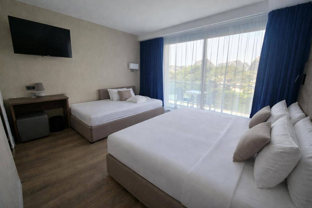 Un ou plusieurs lits dans un hébergement de l'établissement Hotel Europa