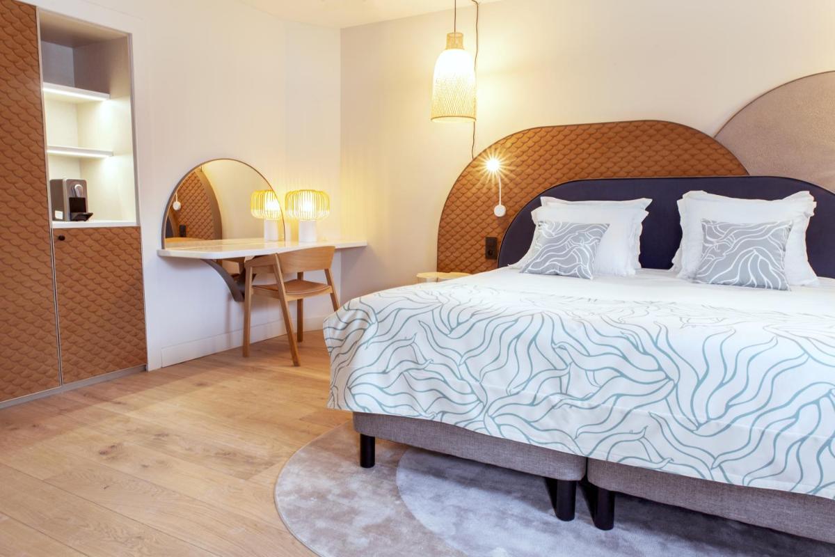 Un ou plusieurs lits dans un hébergement de l'établissement Black Bass Hotel