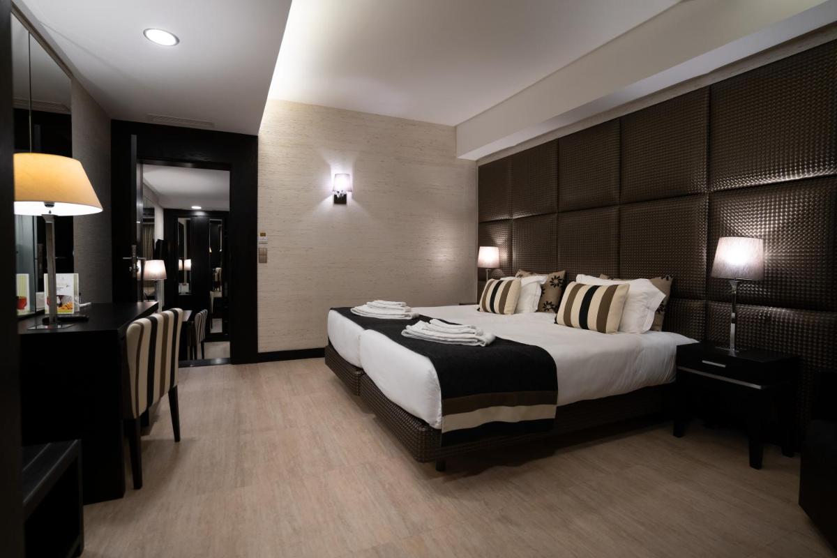 Uma cama ou camas num quarto em Alambique - Hotel Resort & Spa