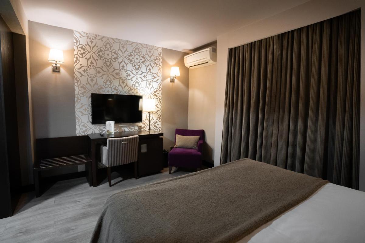 Uma cama ou camas num quarto em Alambique - Hotel Resort & Spa