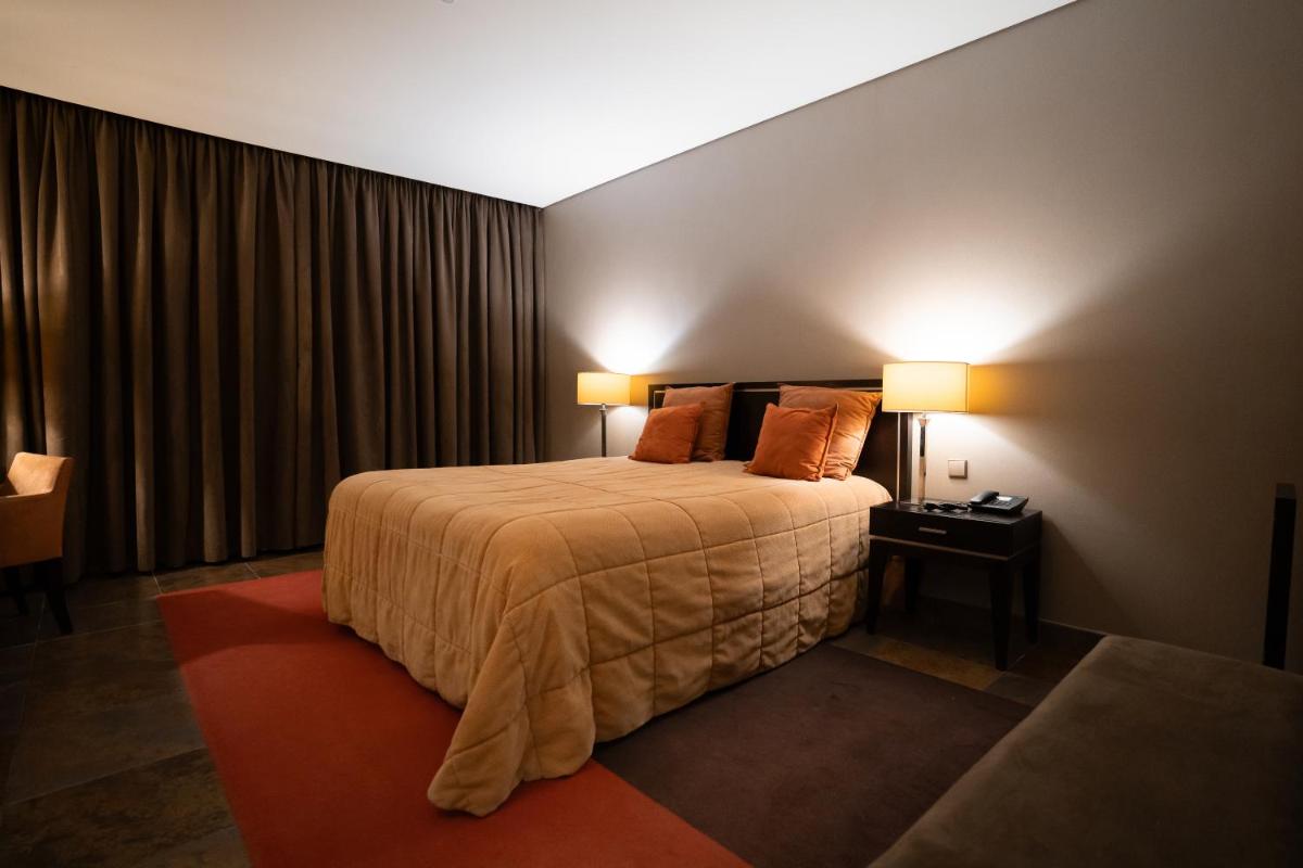 Uma cama ou camas num quarto em Alambique - Hotel Resort & Spa