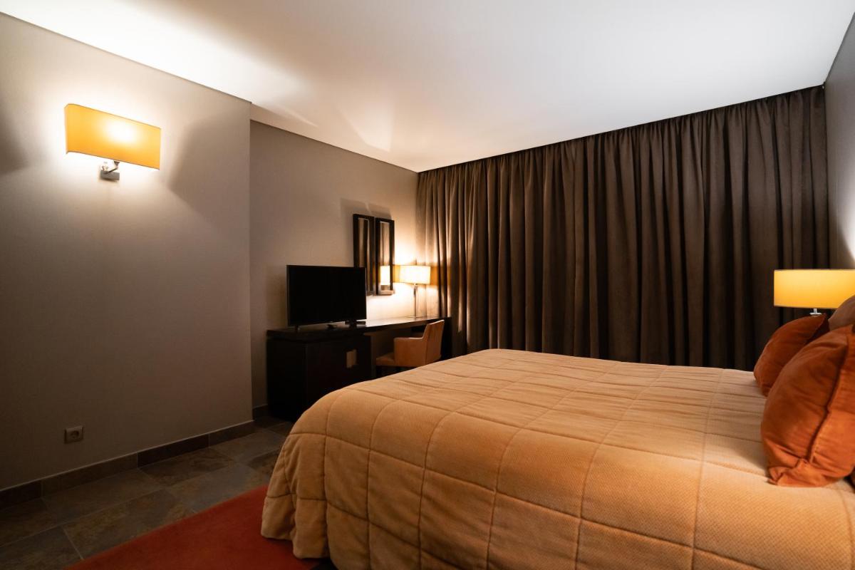 Uma cama ou camas num quarto em Alambique - Hotel Resort & Spa