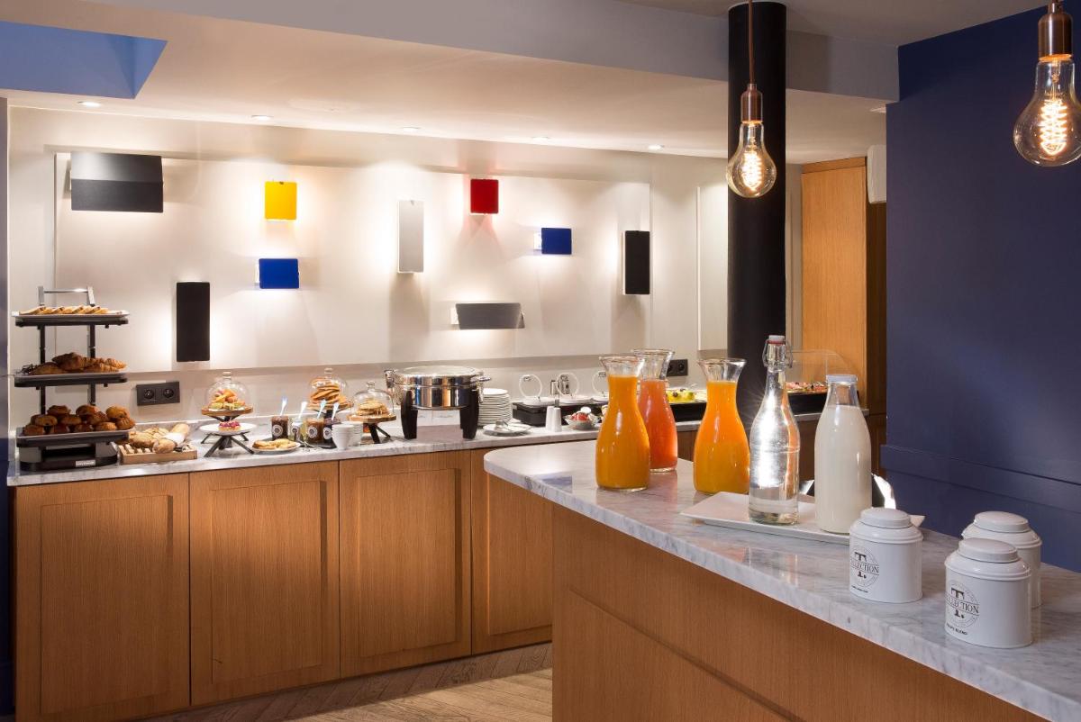 Cuisine ou kitchenette dans l'établissement Les Matins de Paris & Spa