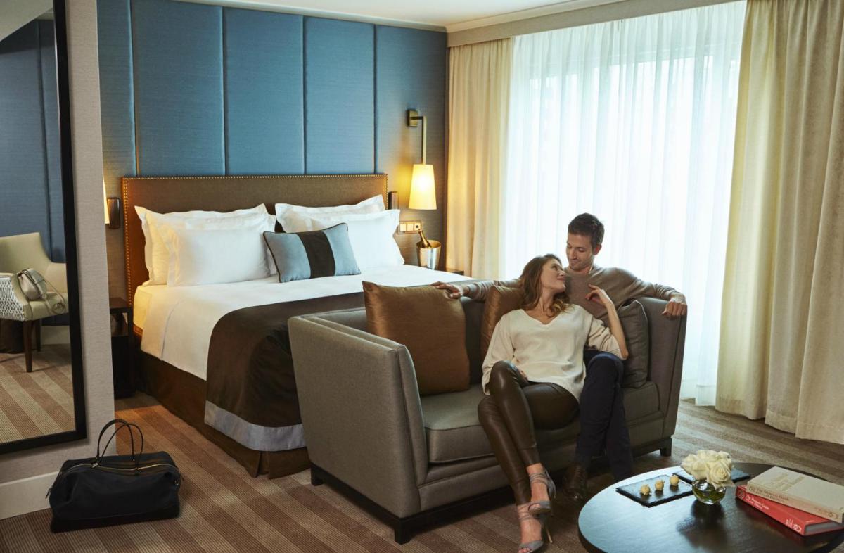 Uma cama ou camas num quarto em Corinthia Lisbon