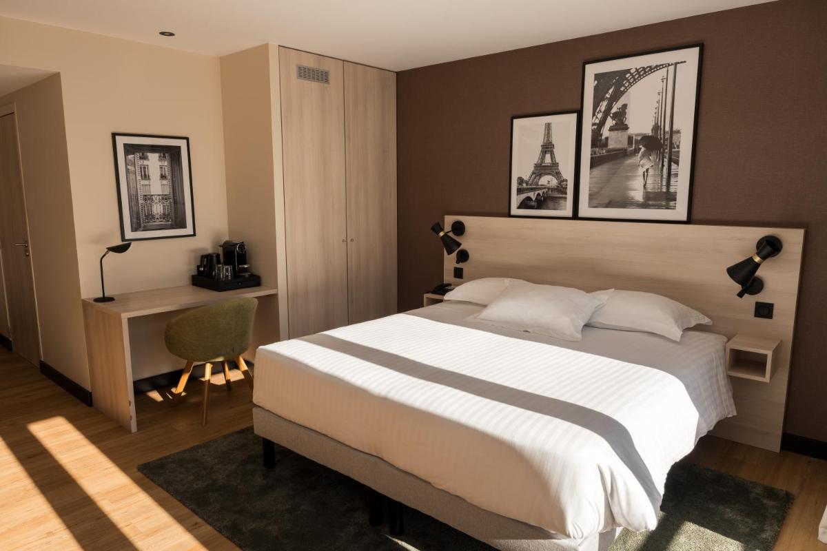 Un ou plusieurs lits dans un hébergement de l'établissement Le Relais de La Malmaison, a member of Radisson Individuals