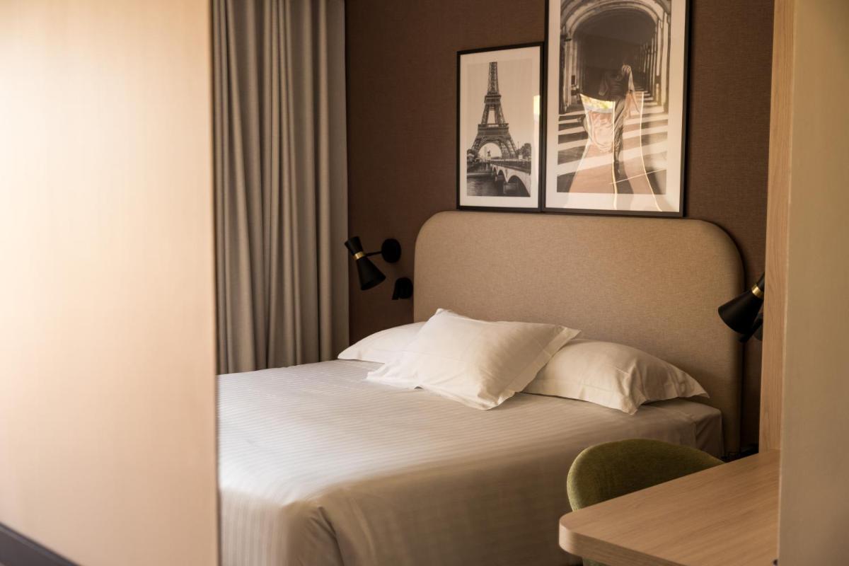 Un ou plusieurs lits dans un hébergement de l'établissement Le Relais de La Malmaison, a member of Radisson Individuals
