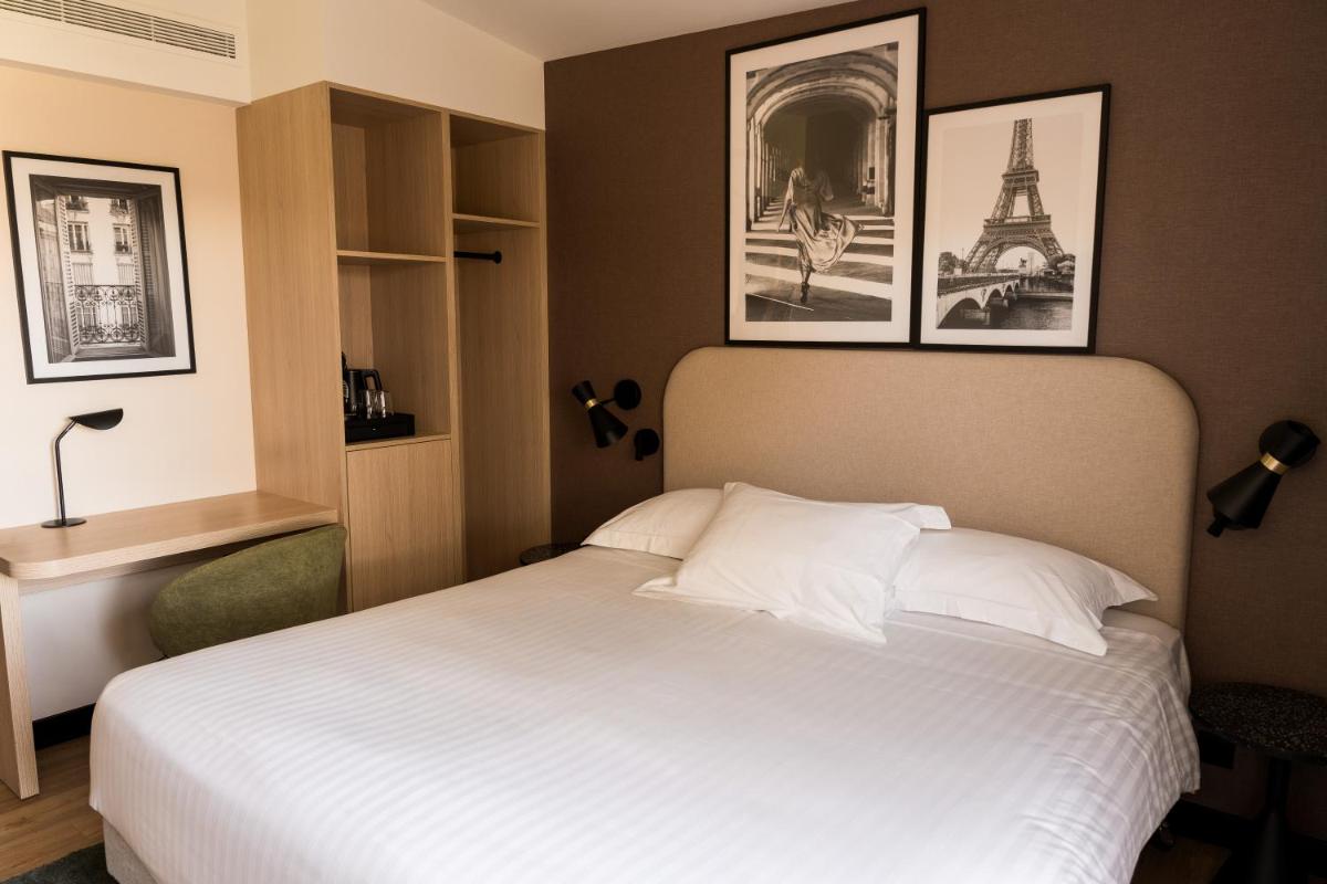 Un ou plusieurs lits dans un hébergement de l'établissement Le Relais de La Malmaison, a member of Radisson Individuals
