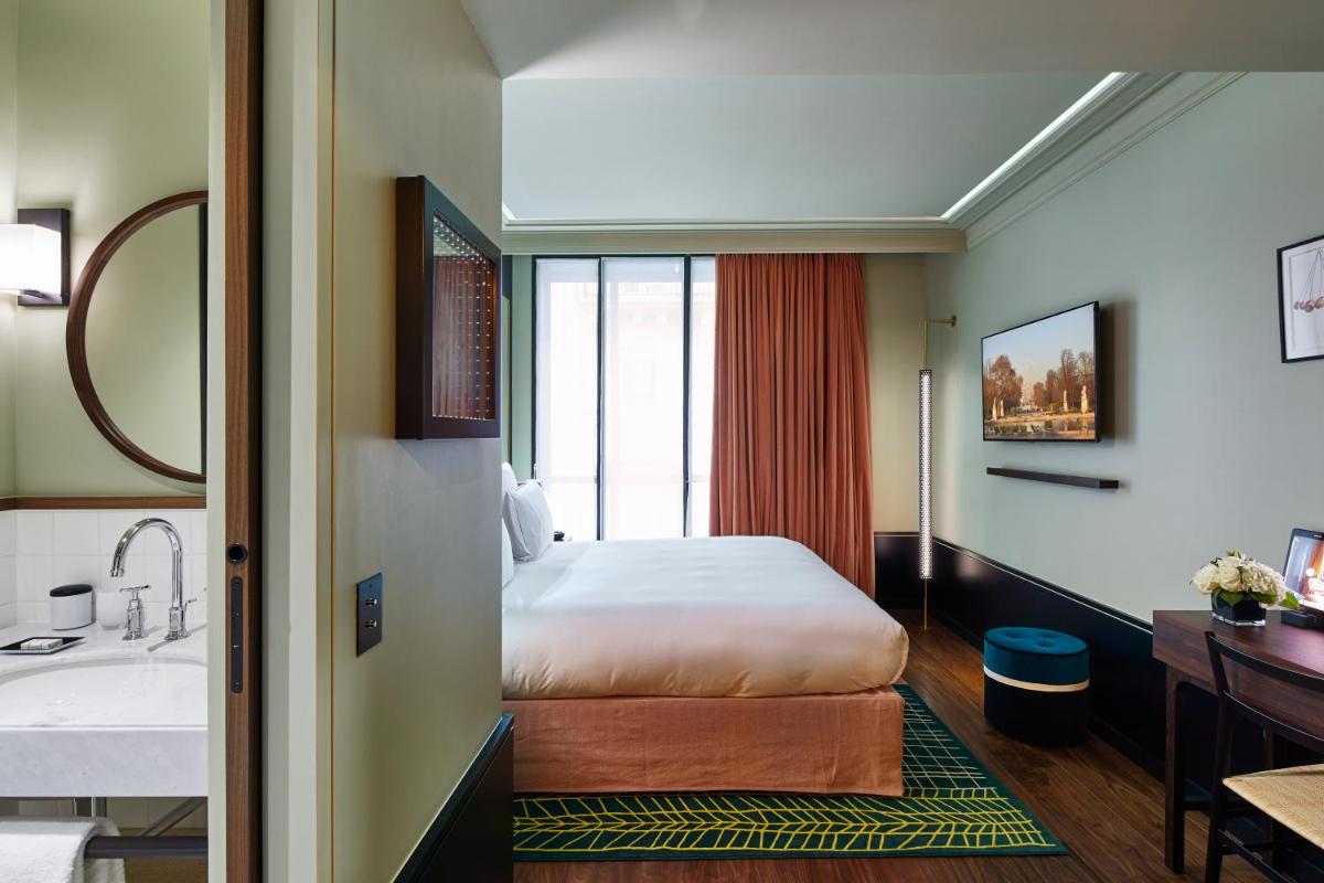 Un ou plusieurs lits dans un hébergement de l'établissement Le Roch Hotel & Spa