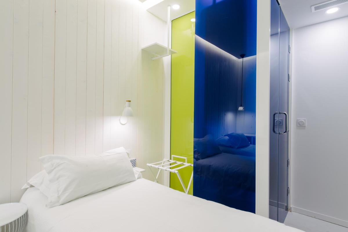 Un ou plusieurs lits dans un hébergement de l'établissement Atypik Hotel