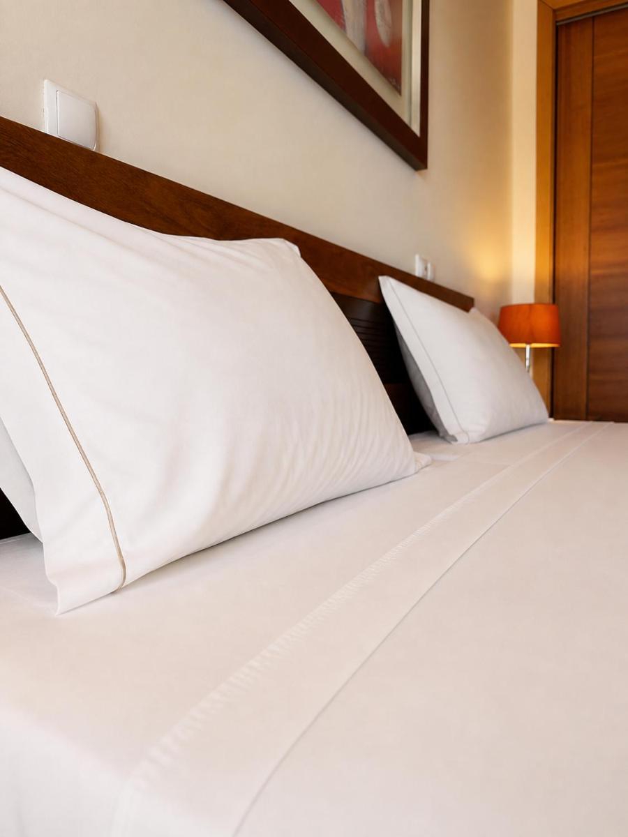 Uma cama ou camas num quarto em Cerro Mar Atlantico & Cerro Mar Garden
