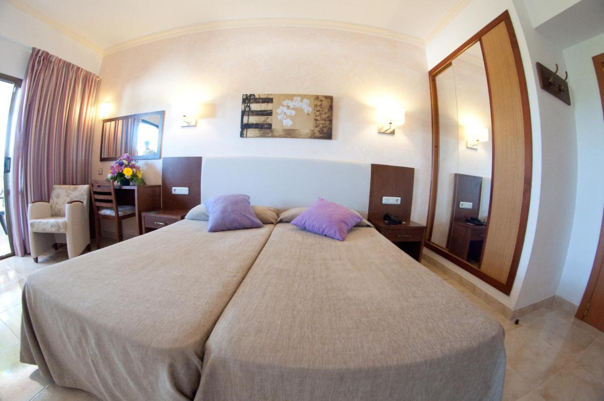 Cama o camas de una habitación en Hotel Cala Gat