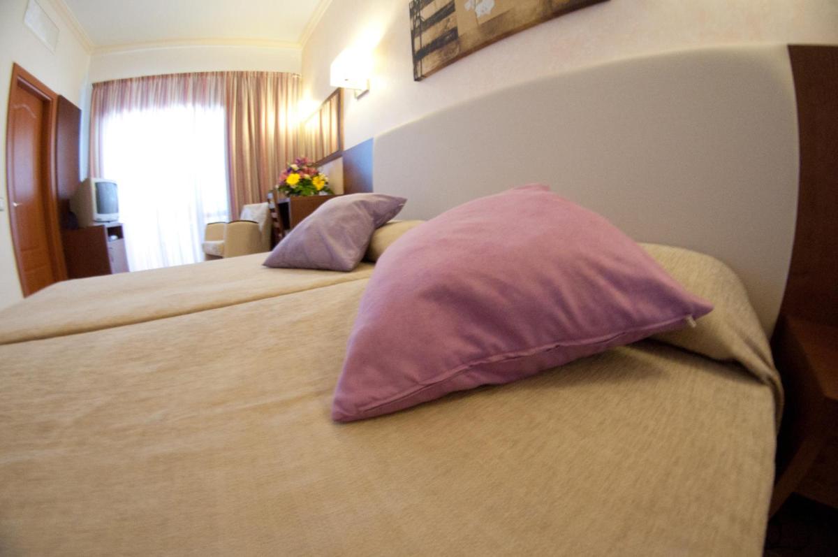 Cama o camas de una habitación en Hotel Cala Gat