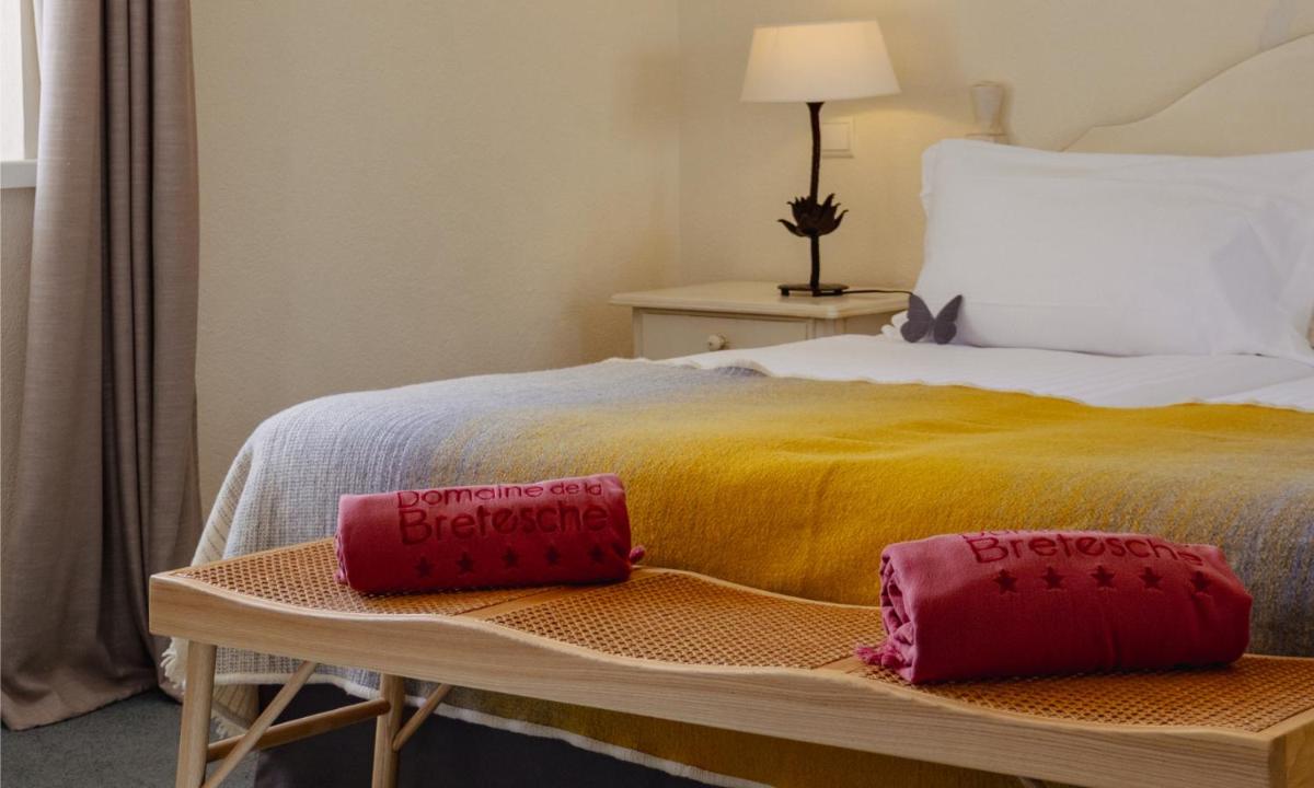 Un ou plusieurs lits dans un hébergement de l'établissement Hôtel & Spa de La Bretesche