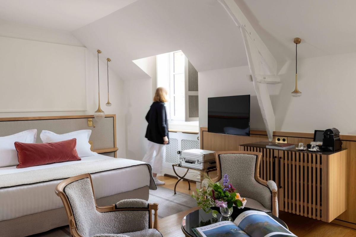 Télévision ou salle de divertissement dans l'établissement Hôtel & Spa de La Bretesche