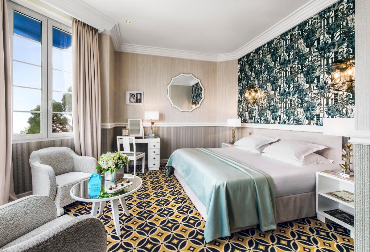 Un ou plusieurs lits dans un hébergement de l'établissement Hôtel Belles Rives