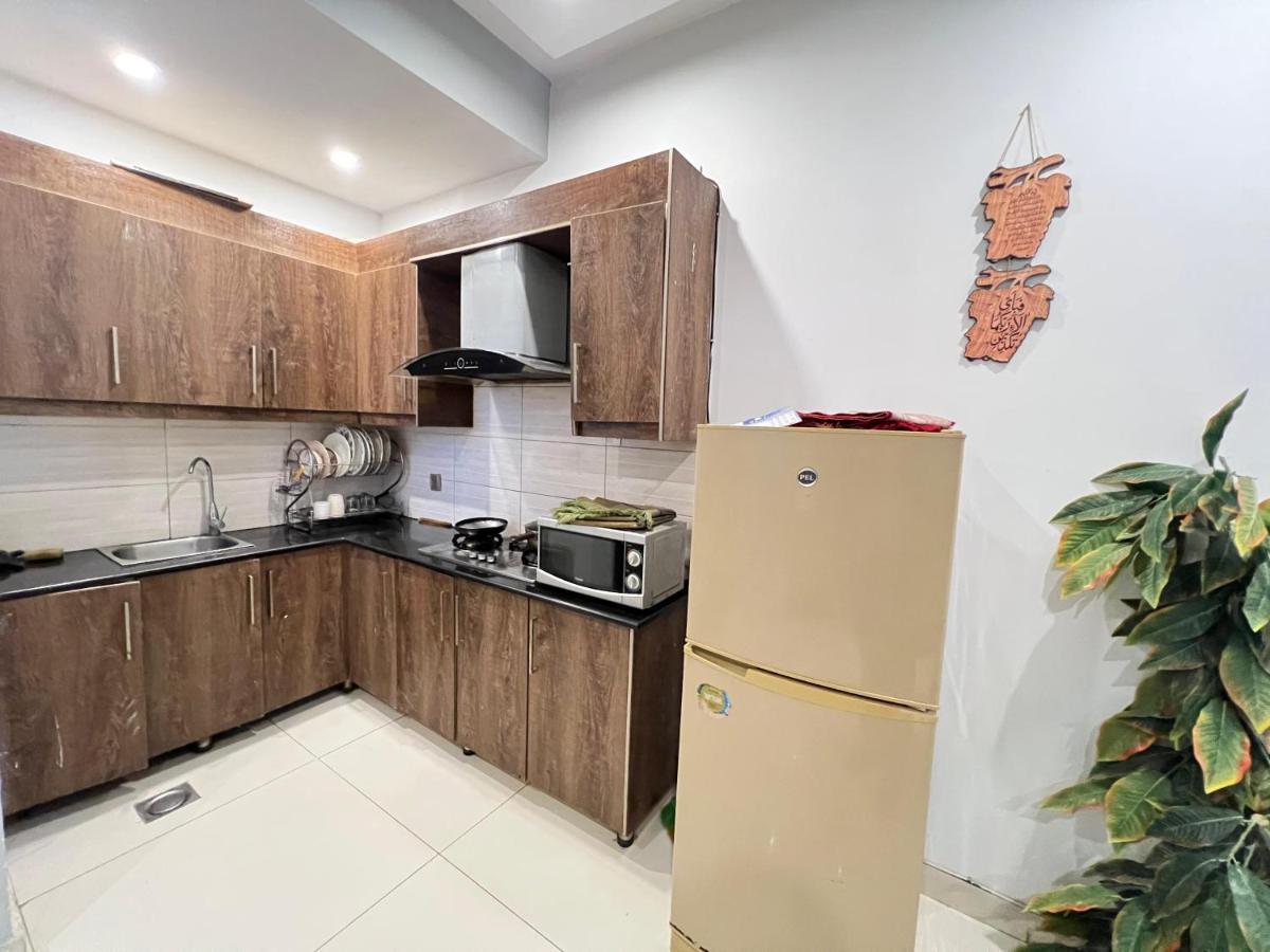 Comfort Hub Modern 2BR Apartments, prime location,Netflix WiFi - Hizvo