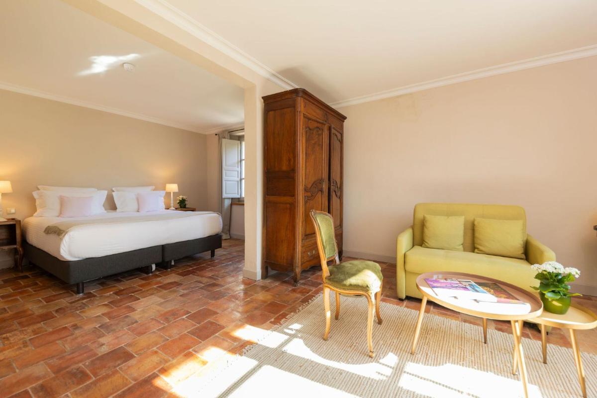 Un ou plusieurs lits dans un hébergement de l'établissement Hôtel - Restaurant & Spa La Magdeleine - Mathias Dandine