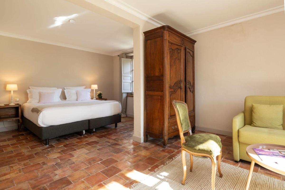 Un ou plusieurs lits dans un hébergement de l'établissement Hôtel - Restaurant & Spa La Magdeleine - Mathias Dandine