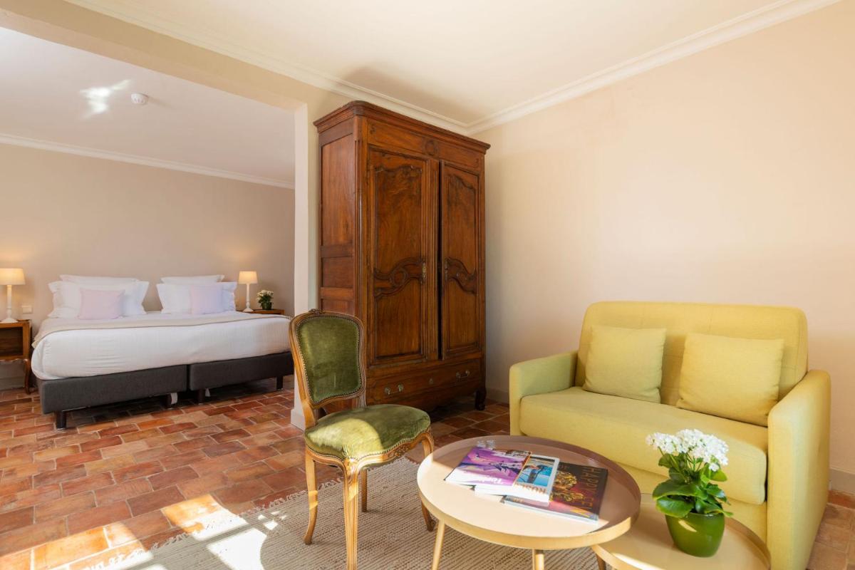 Un ou plusieurs lits dans un hébergement de l'établissement Hôtel - Restaurant & Spa La Magdeleine - Mathias Dandine