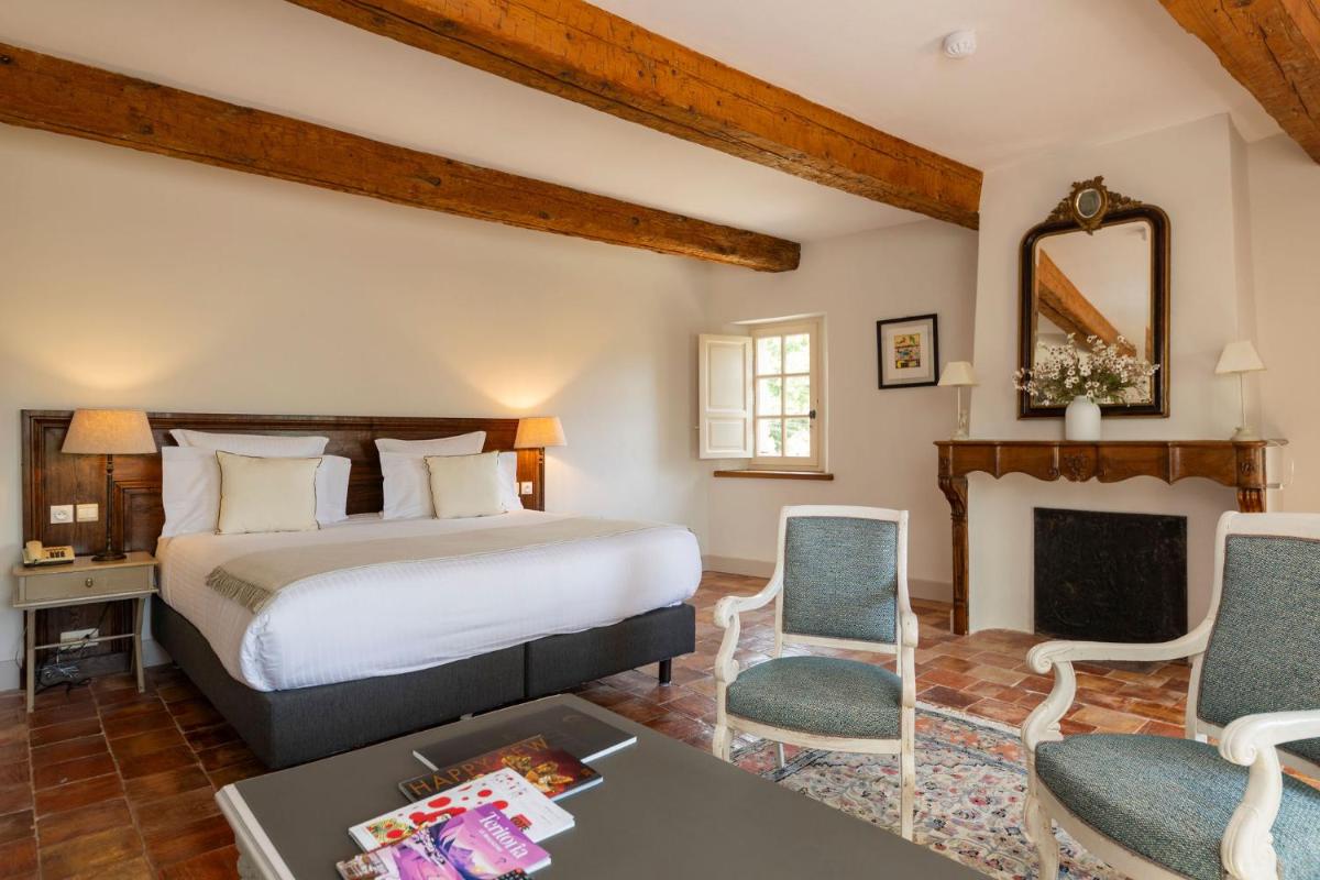 Un ou plusieurs lits dans un hébergement de l'établissement Hôtel - Restaurant & Spa La Magdeleine - Mathias Dandine