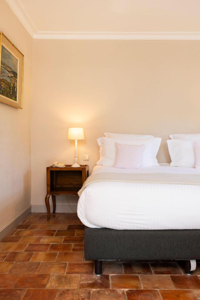 Un ou plusieurs lits dans un hébergement de l'établissement Hôtel - Restaurant & Spa La Magdeleine - Mathias Dandine