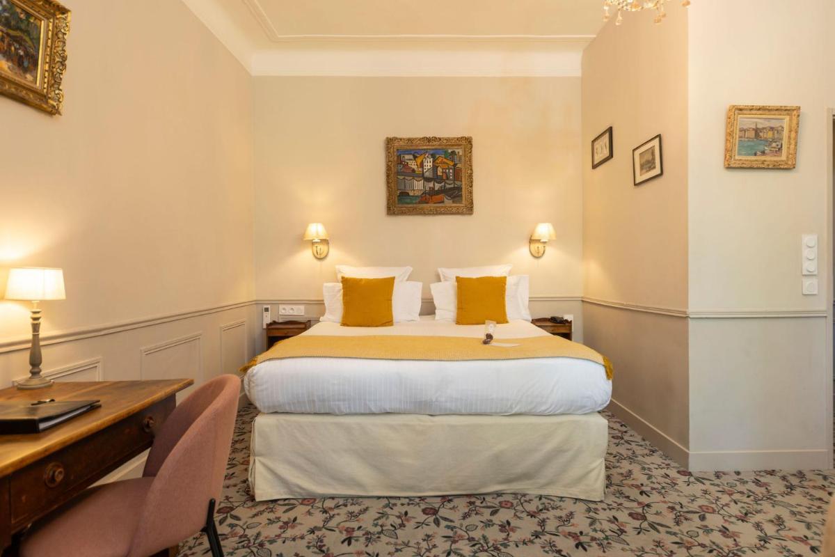 Un ou plusieurs lits dans un hébergement de l'établissement Hôtel - Restaurant & Spa La Magdeleine - Mathias Dandine