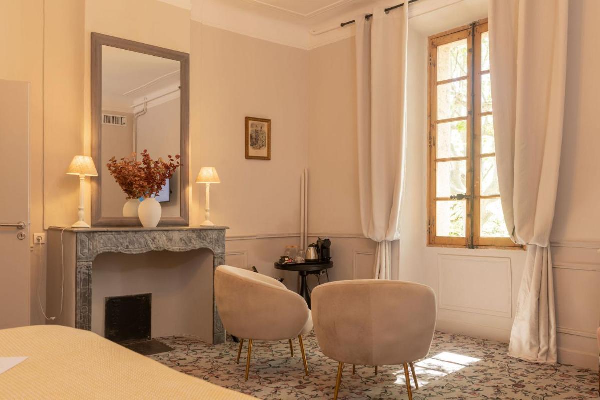 Un ou plusieurs lits dans un hébergement de l'établissement Hôtel - Restaurant & Spa La Magdeleine - Mathias Dandine
