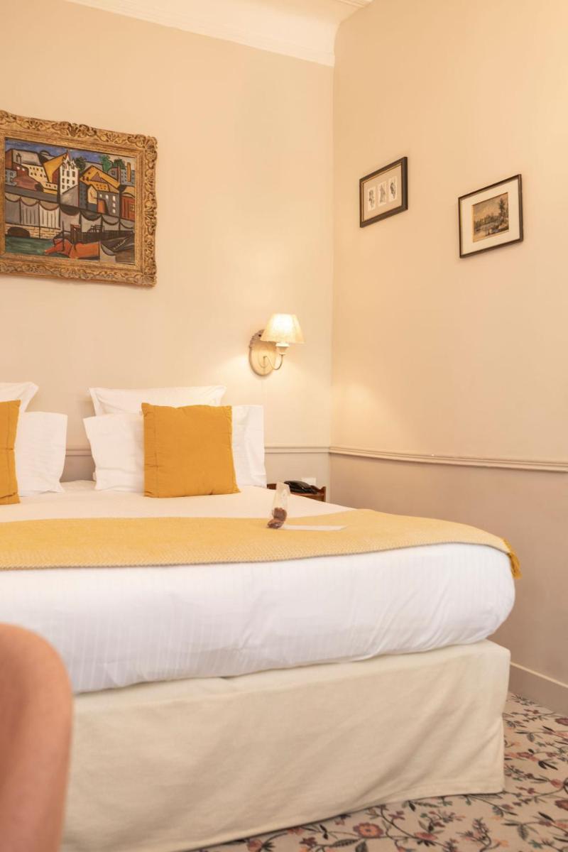 Un ou plusieurs lits dans un hébergement de l'établissement Hôtel - Restaurant & Spa La Magdeleine - Mathias Dandine