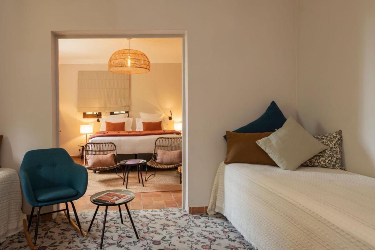 Un ou plusieurs lits dans un hébergement de l'établissement Hôtel - Restaurant & Spa La Magdeleine - Mathias Dandine