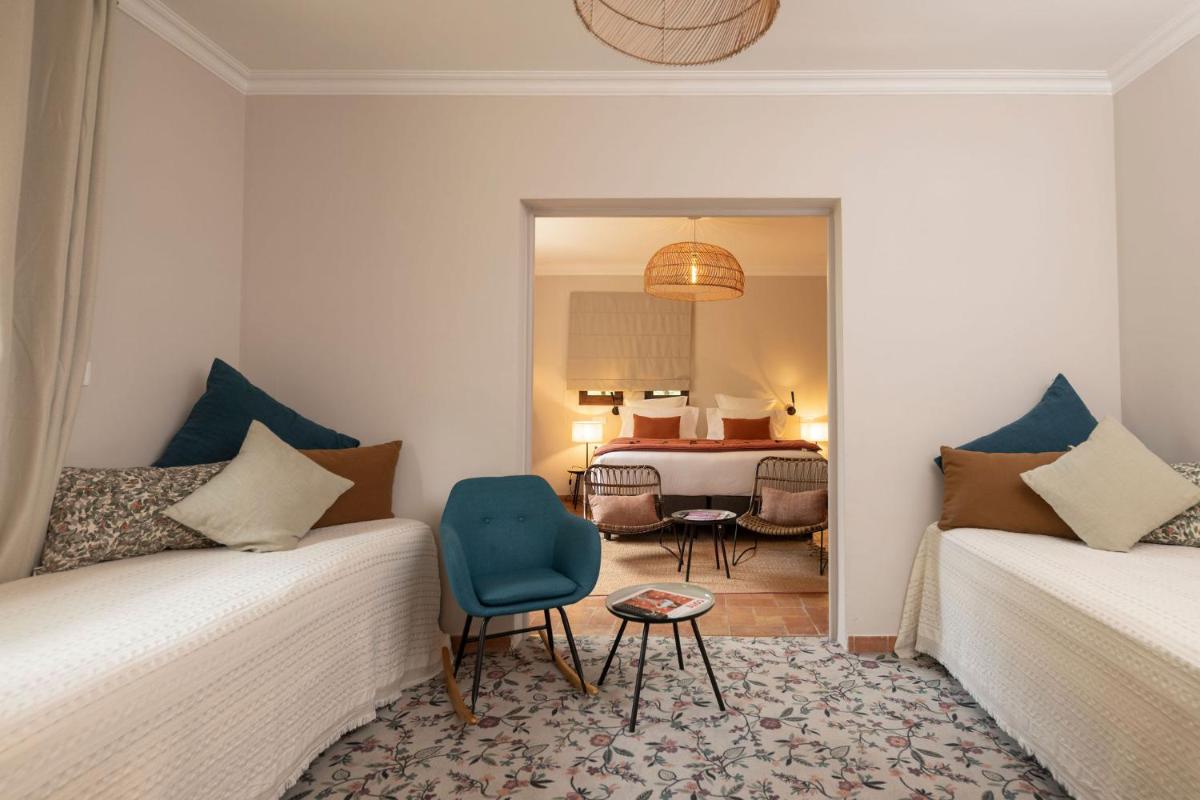 Un ou plusieurs lits dans un hébergement de l'établissement Hôtel - Restaurant & Spa La Magdeleine - Mathias Dandine