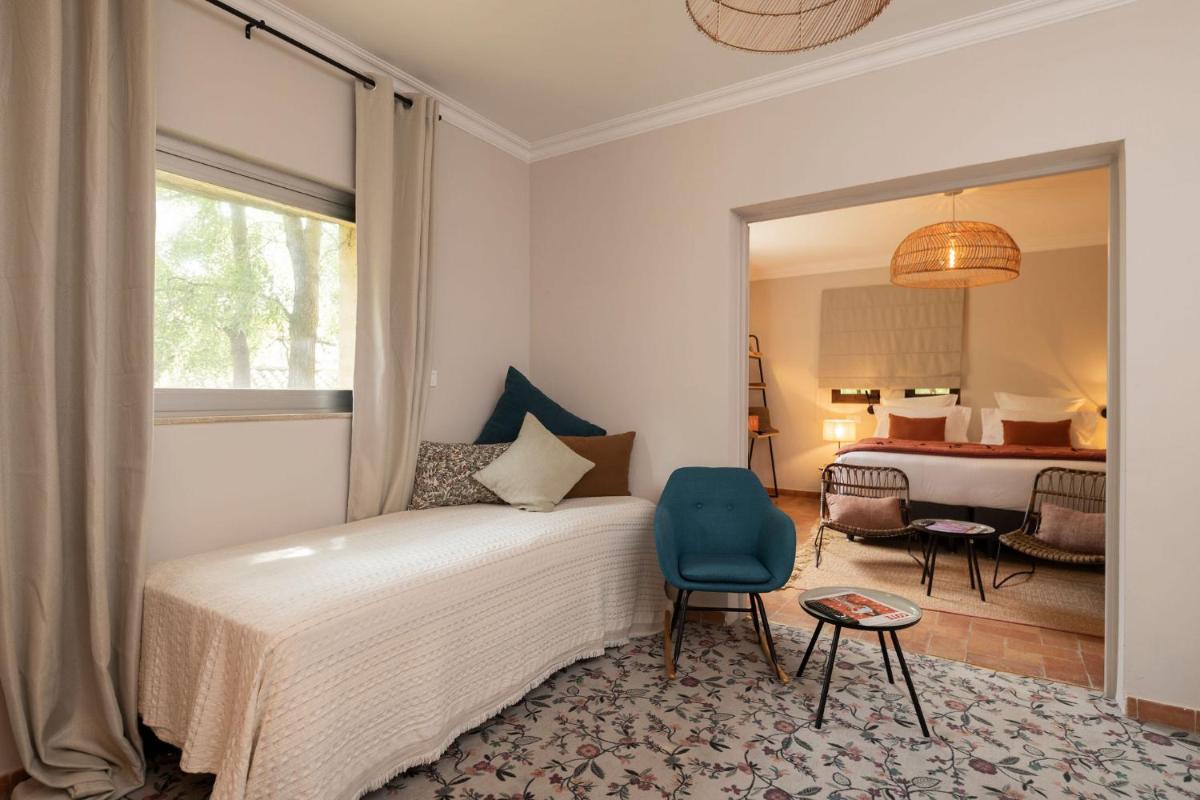 Un ou plusieurs lits dans un hébergement de l'établissement Hôtel - Restaurant & Spa La Magdeleine - Mathias Dandine