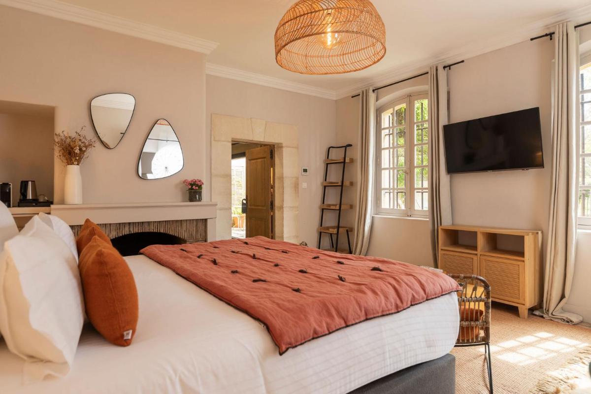 Un ou plusieurs lits dans un hébergement de l'établissement Hôtel - Restaurant & Spa La Magdeleine - Mathias Dandine
