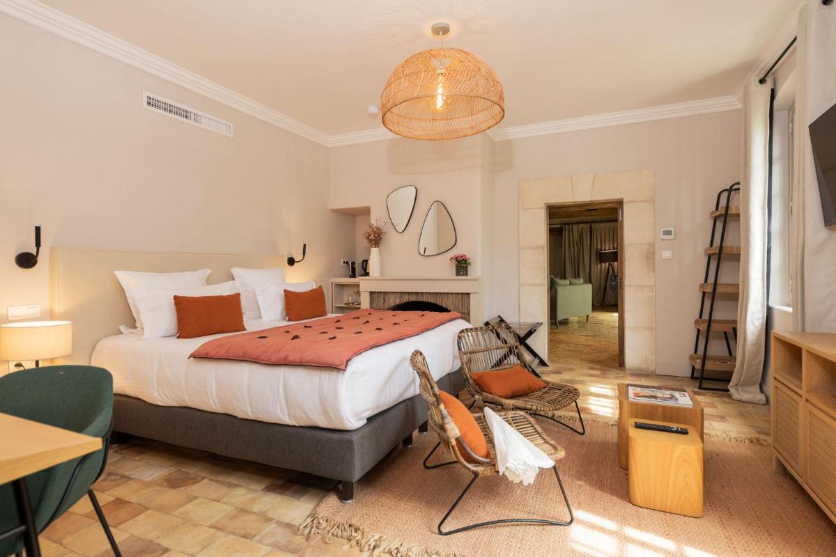 Un ou plusieurs lits dans un hébergement de l'établissement Hôtel - Restaurant & Spa La Magdeleine - Mathias Dandine