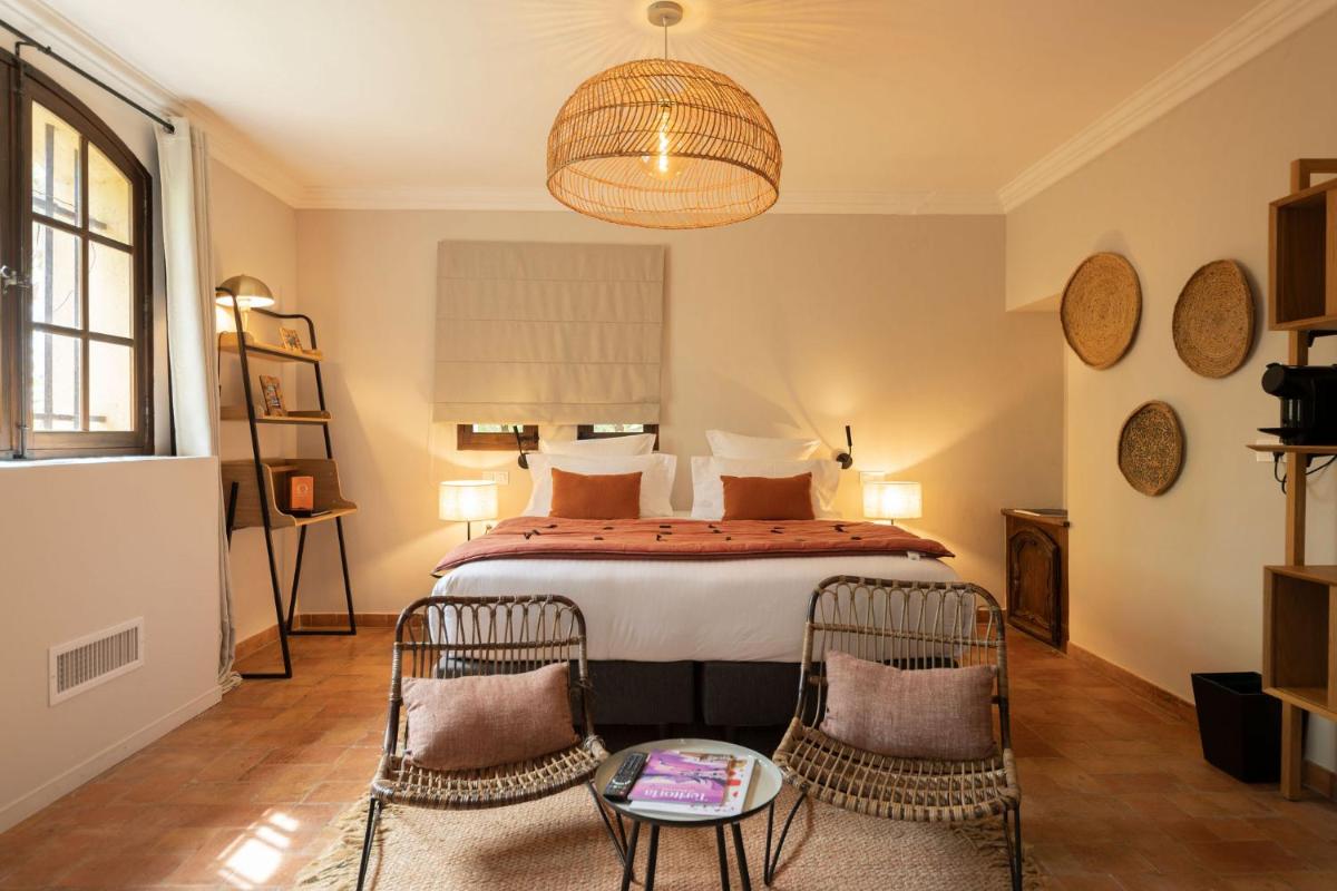 Un ou plusieurs lits dans un hébergement de l'établissement Hôtel - Restaurant & Spa La Magdeleine - Mathias Dandine