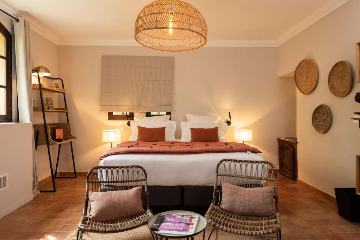 Un ou plusieurs lits dans un hébergement de l'établissement Hôtel - Restaurant & Spa La Magdeleine - Mathias Dandine