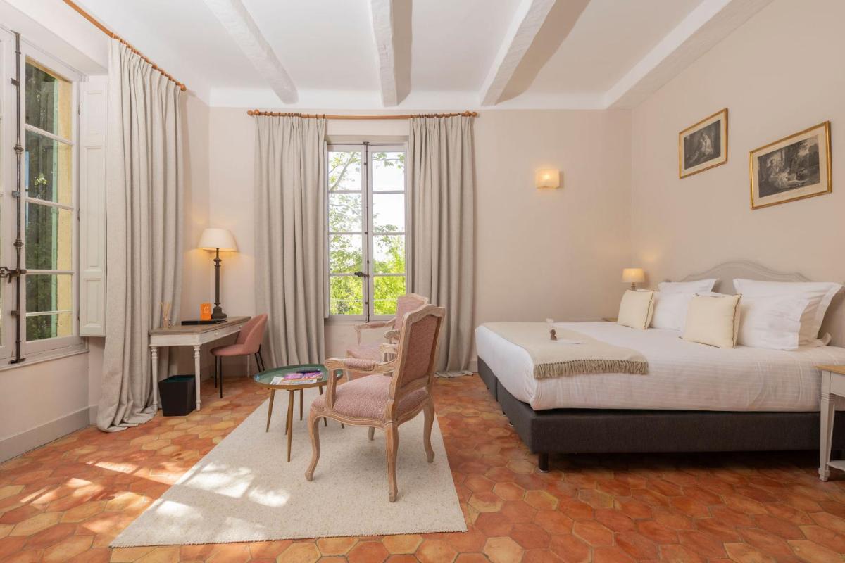 Un ou plusieurs lits dans un hébergement de l'établissement Hôtel - Restaurant & Spa La Magdeleine - Mathias Dandine