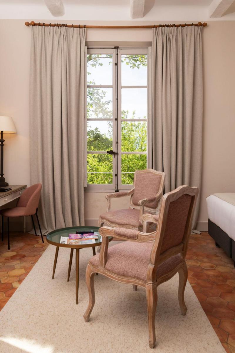 Un ou plusieurs lits dans un hébergement de l'établissement Hôtel - Restaurant & Spa La Magdeleine - Mathias Dandine