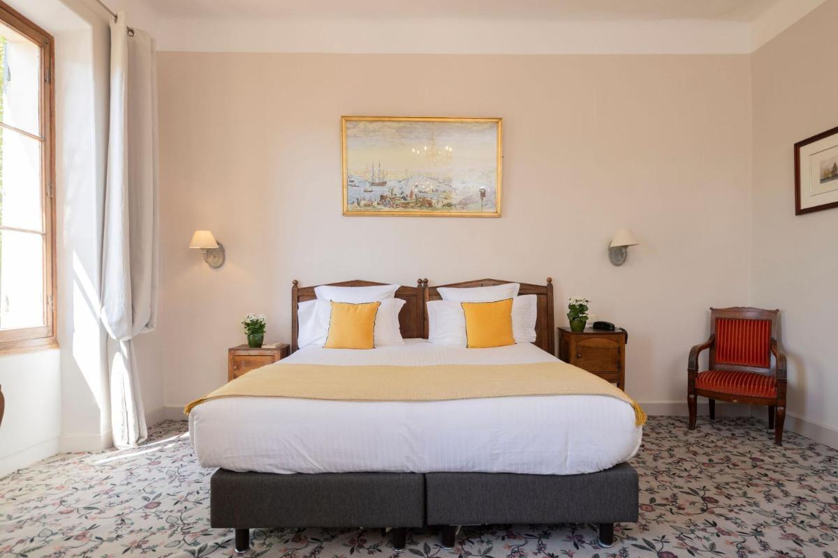 Un ou plusieurs lits dans un hébergement de l'établissement Hôtel - Restaurant & Spa La Magdeleine - Mathias Dandine