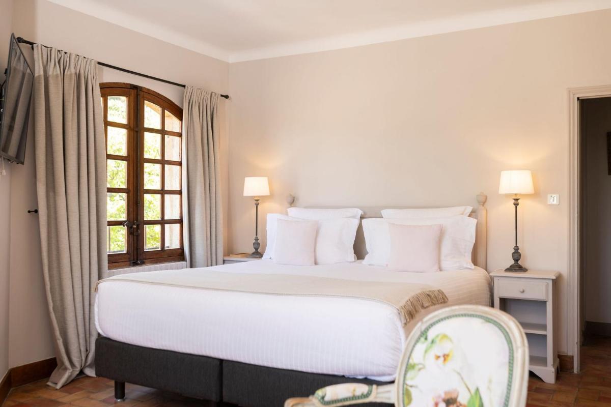 Un ou plusieurs lits dans un hébergement de l'établissement Hôtel - Restaurant & Spa La Magdeleine - Mathias Dandine
