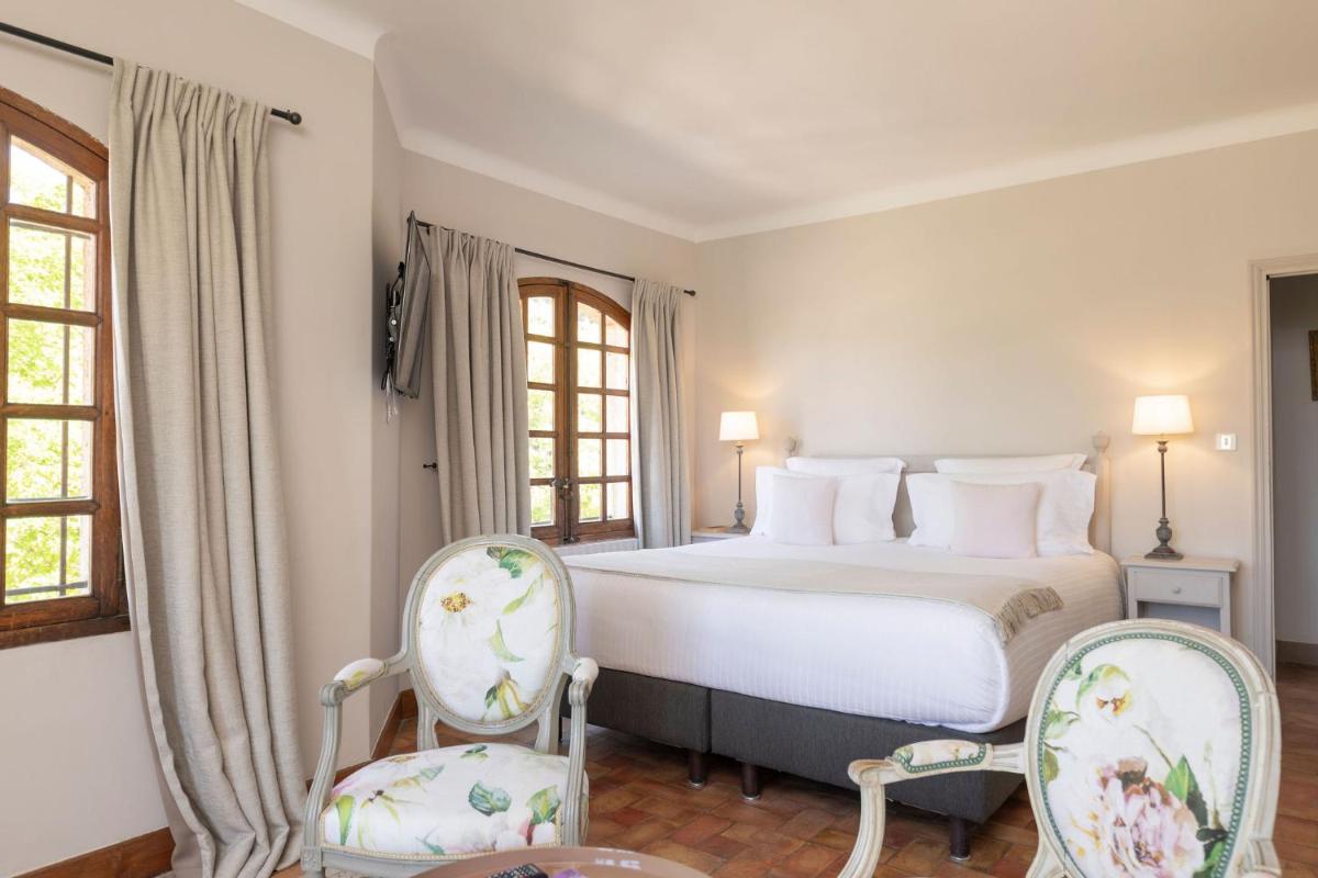 Un ou plusieurs lits dans un hébergement de l'établissement Hôtel - Restaurant & Spa La Magdeleine - Mathias Dandine