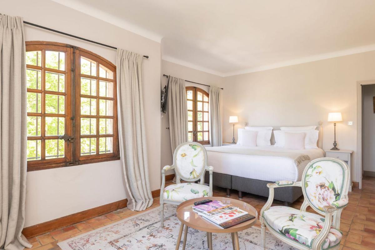 Un ou plusieurs lits dans un hébergement de l'établissement Hôtel - Restaurant & Spa La Magdeleine - Mathias Dandine