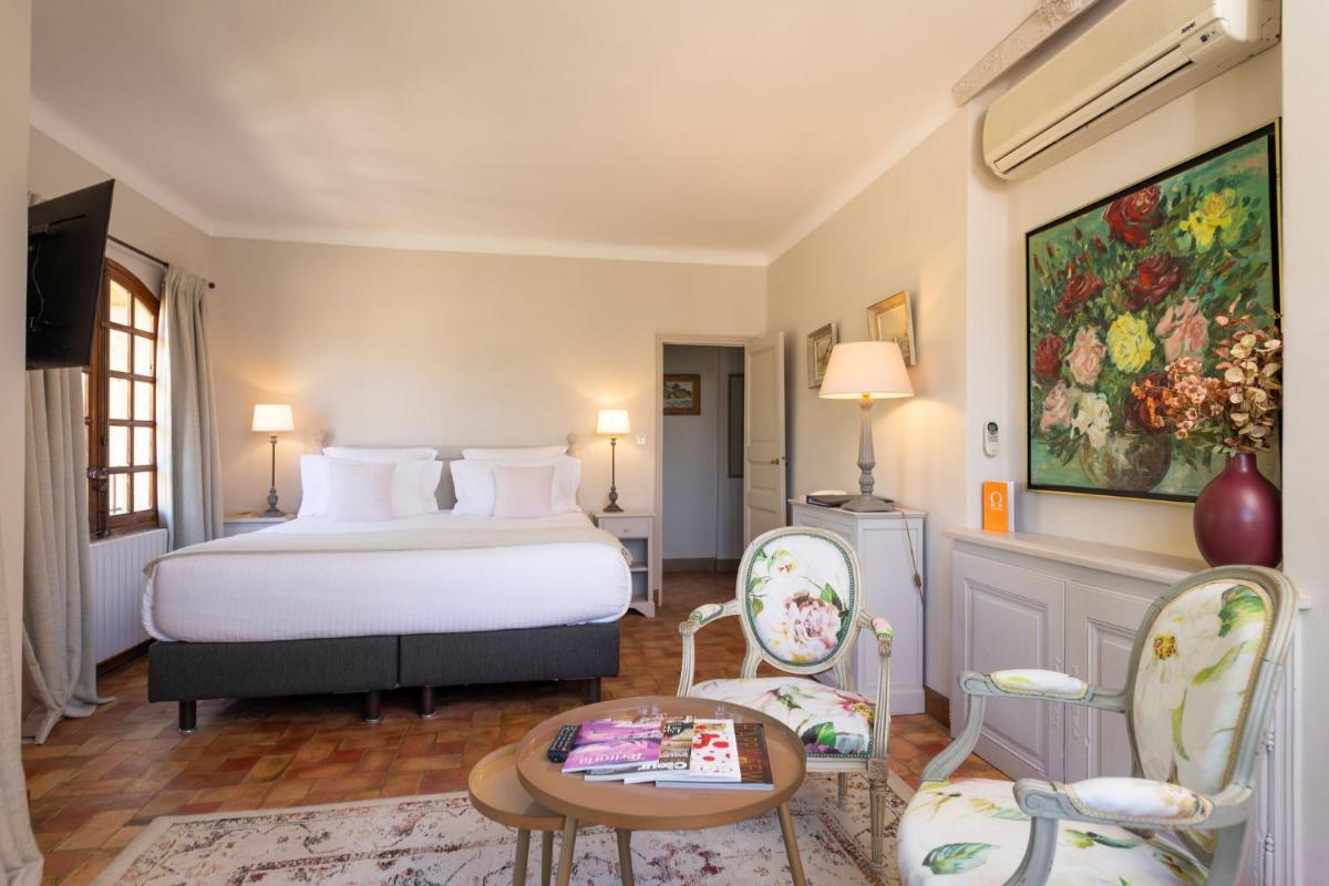 Un ou plusieurs lits dans un hébergement de l'établissement Hôtel - Restaurant & Spa La Magdeleine - Mathias Dandine