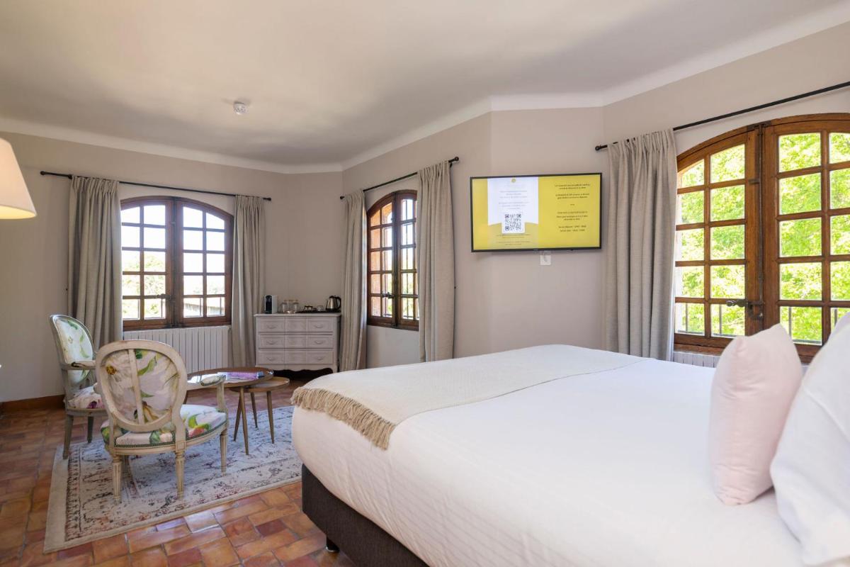 Un ou plusieurs lits dans un hébergement de l'établissement Hôtel - Restaurant & Spa La Magdeleine - Mathias Dandine