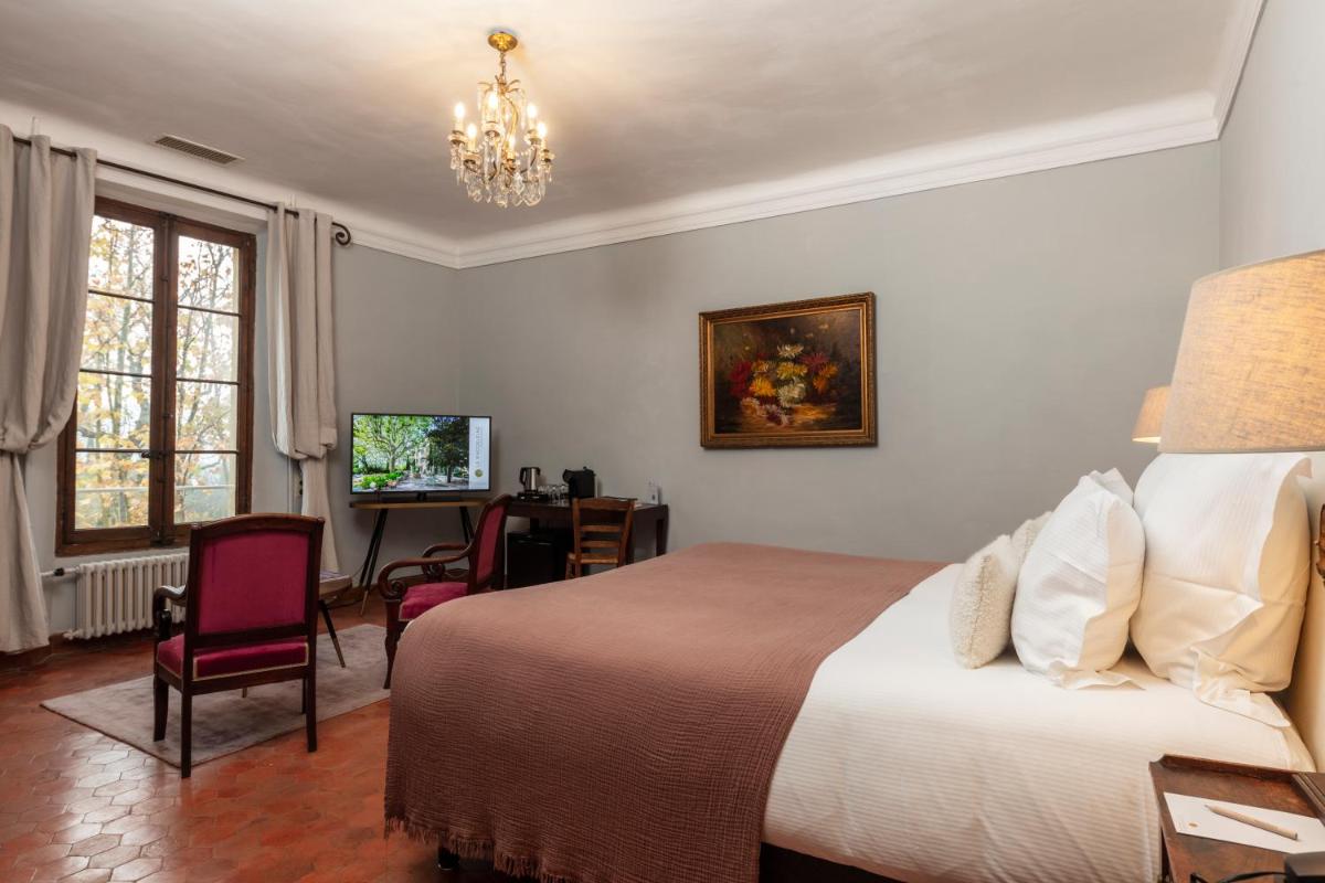 Un ou plusieurs lits dans un hébergement de l'établissement Hôtel - Restaurant & Spa La Magdeleine - Mathias Dandine
