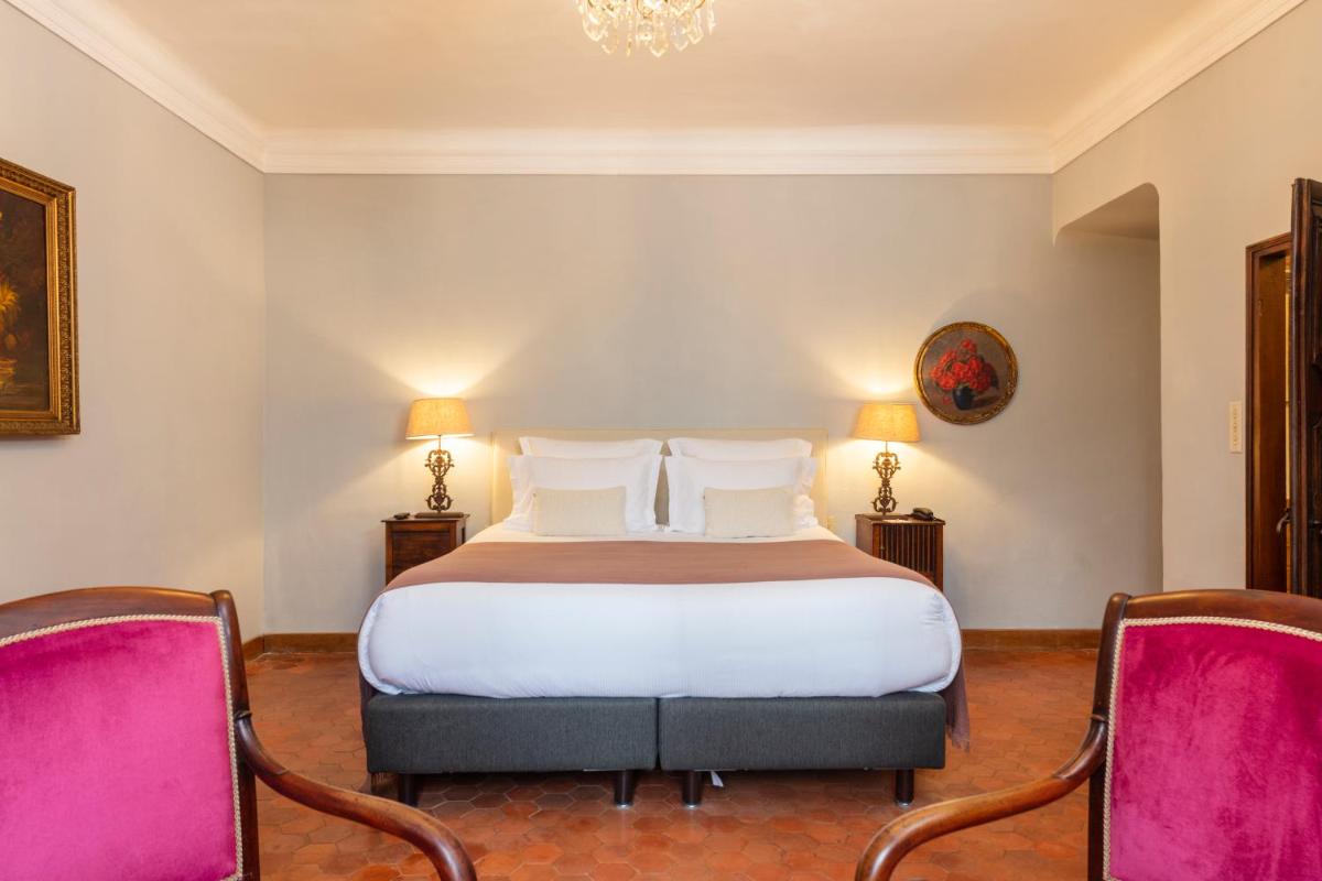 Un ou plusieurs lits dans un hébergement de l'établissement Hôtel - Restaurant & Spa La Magdeleine - Mathias Dandine