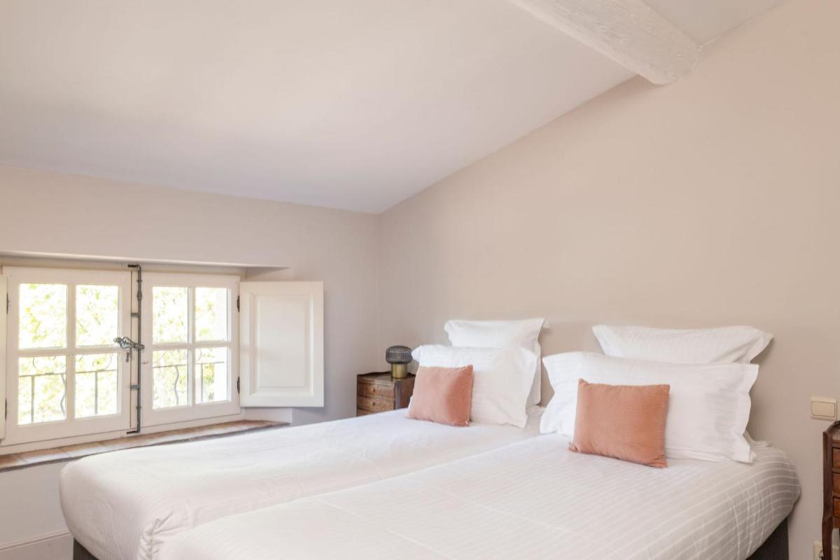 Un ou plusieurs lits dans un hébergement de l'établissement Hôtel - Restaurant & Spa La Magdeleine - Mathias Dandine