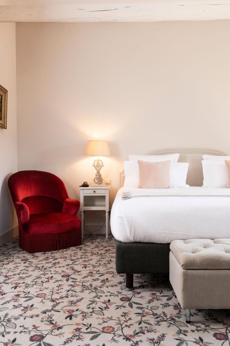 Un ou plusieurs lits dans un hébergement de l'établissement Hôtel - Restaurant & Spa La Magdeleine - Mathias Dandine