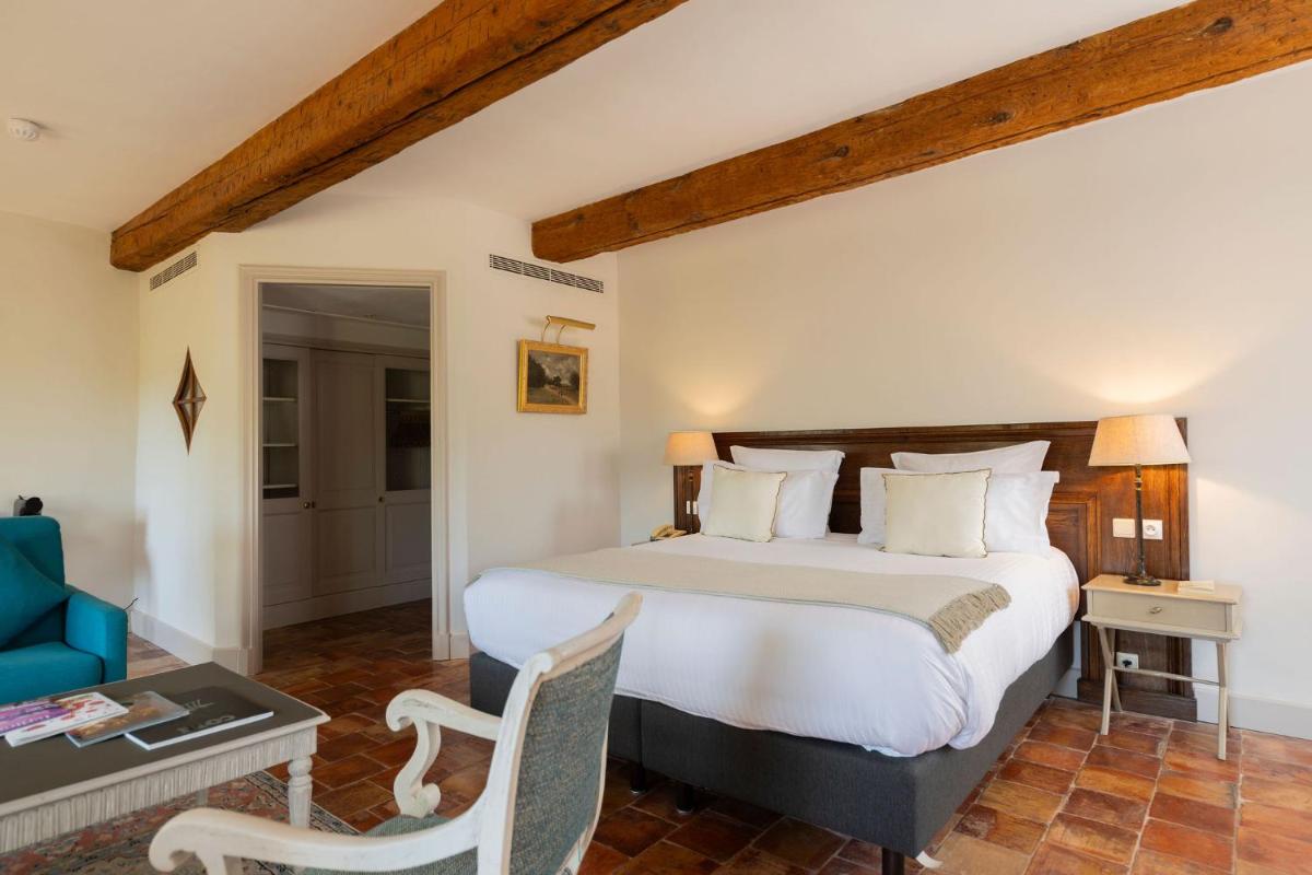 Un ou plusieurs lits dans un hébergement de l'établissement Hôtel - Restaurant & Spa La Magdeleine - Mathias Dandine