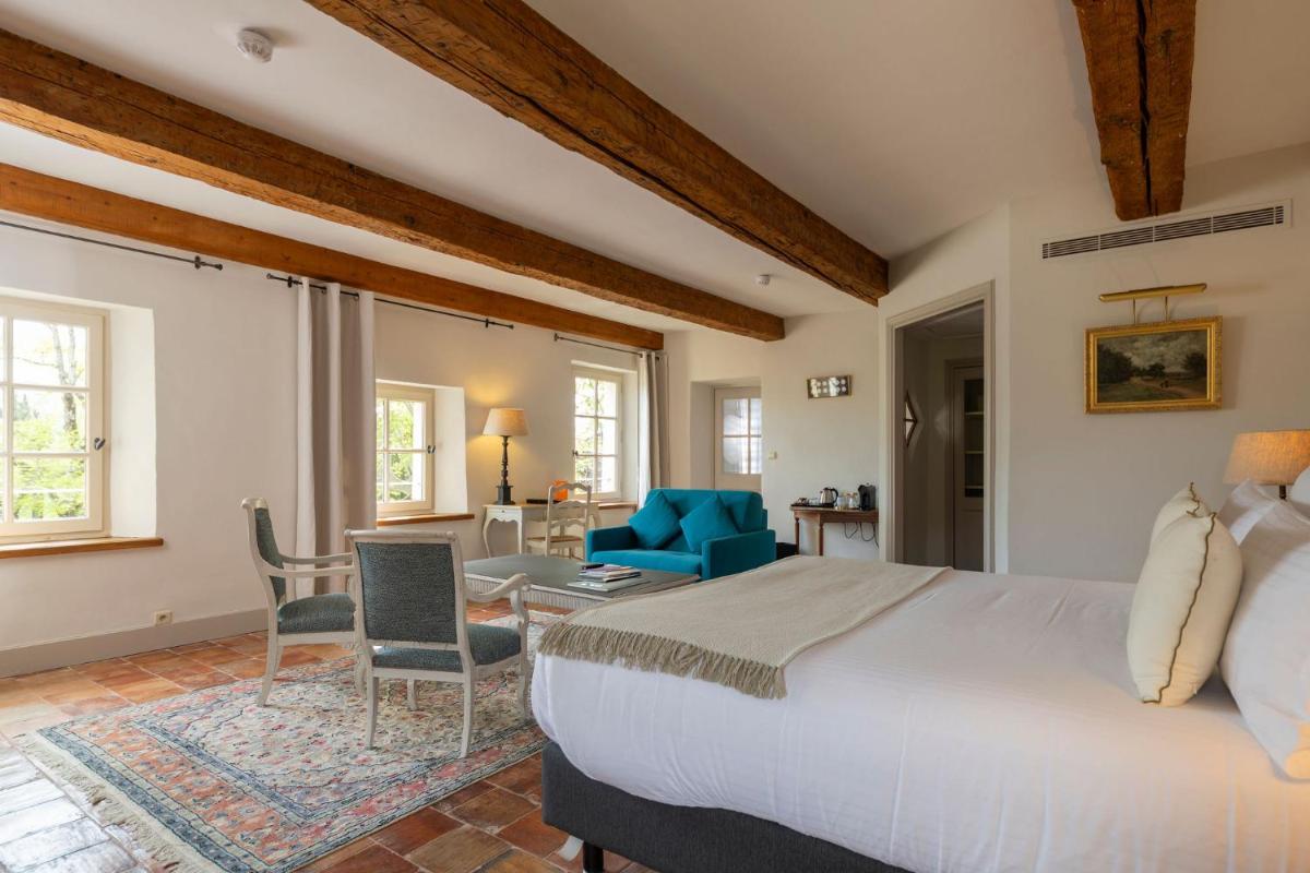 Un ou plusieurs lits dans un hébergement de l'établissement Hôtel - Restaurant & Spa La Magdeleine - Mathias Dandine